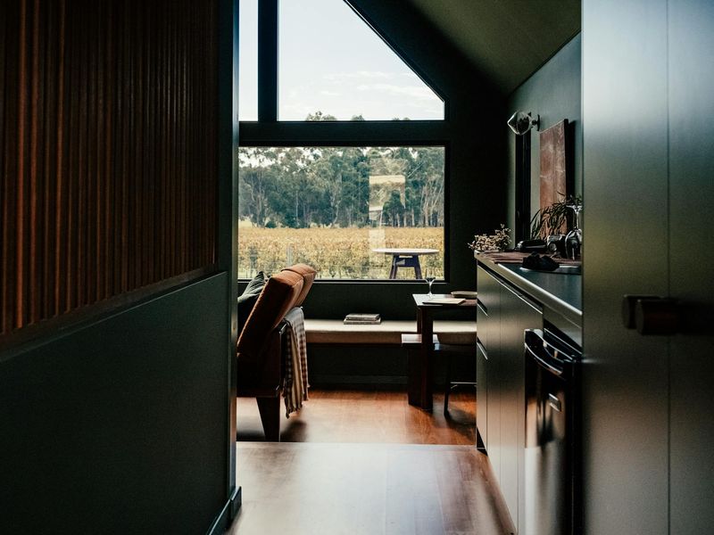 Wide view of a minimalist room prepared for a workout, showing ample space.
